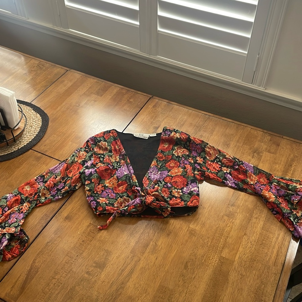 Vintage spoiled girl size small tie front blouse. Bell sleeves with floral.